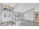 Open concept living area with gray walls and luxury vinyl plank flooring at 2 Broadmoor Rd, Rotonda West, FL 33947