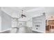 Spacious living room with gray walls, wood-look floors, and high ceilings at 2 Broadmoor Rd, Rotonda West, FL 33947