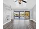 Living room with sliding doors leading to a pool and patio area at 2 Broadmoor Rd, Rotonda West, FL 33947