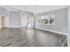 Spacious living room with gray walls, luxury vinyl flooring and lots of natural light at 2 Broadmoor Rd, Rotonda West, FL 33947