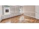 Bright office with built-in shelving and hardwood floors at 2 Broadmoor Rd, Rotonda West, FL 33947