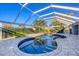 Screened pool and spa with spacious patio at 2 Broadmoor Rd, Rotonda West, FL 33947