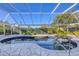Inviting pool and spa area with screened enclosure at 2 Broadmoor Rd, Rotonda West, FL 33947