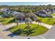 Sprawling one-story home with mature landscaping, circular driveway, and a three-car garage at 2 Marker Rd, Rotonda West, FL 33947