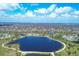 Aerial view of neighborhood with lake at 2 Marker Rd, Rotonda West, FL 33947