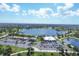 Aerial view of community with lake and clubhouse at 2 Marker Rd, Rotonda West, FL 33947