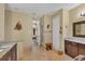 Primary bathroom with double vanity and access to other rooms at 2 Marker Rd, Rotonda West, FL 33947