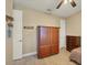 Bedroom with large wooden armoire and chest of drawers at 2 Marker Rd, Rotonda West, FL 33947