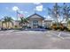 Community building exterior showcasing entrance and landscaping at 2 Marker Rd, Rotonda West, FL 33947