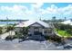 Community center with parking and American flag at 2 Marker Rd, Rotonda West, FL 33947
