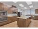 Modern kitchen with island and stainless steel appliances at 2 Marker Rd, Rotonda West, FL 33947