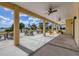 Covered patio overlooking lake with seating and picnic tables at 2 Marker Rd, Rotonda West, FL 33947