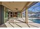 View from inside the house to the pool and patio at 2 Marker Rd, Rotonda West, FL 33947