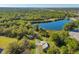 Aerial view of nature trail, pavilion, and old building near lake at 2 Marker Rd, Rotonda West, FL 33947