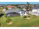 Aerial view showcasing the home's pool and spacious backyard at 213 White Marsh Ln, Rotonda West, FL 33947