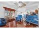 Relaxing sitting area with hardwood floors and comfortable seating near the kitchen at 213 White Marsh Ln, Rotonda West, FL 33947