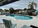 Kidney-shaped swimming pool with a patio and canal view at 2673 Titania Rd, Englewood, FL 34224