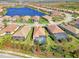 Aerial view of a house with a pool and landscaped backyard in a residential community at 26790 Weiskopf Dr, Englewood, FL 34223
