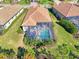 Aerial view showcasing a home's pool and screened patio area at 26790 Weiskopf Dr, Englewood, FL 34223