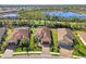 Aerial view of house in residential neighborhood near lake at 26790 Weiskopf Dr, Englewood, FL 34223