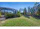 Landscaped backyard with lush greenery and mature trees at 26790 Weiskopf Dr, Englewood, FL 34223