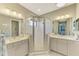 Elegant bathroom with dual vanity, large shower, and modern finishes at 26790 Weiskopf Dr, Englewood, FL 34223