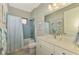 Clean bathroom with tub, shower, and updated vanity at 26790 Weiskopf Dr, Englewood, FL 34223