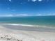 Scenic beachfront view with white sand and calm ocean waters at 26790 Weiskopf Dr, Englewood, FL 34223
