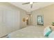 Charming bedroom with a queen-size bed and built-in closet at 26790 Weiskopf Dr, Englewood, FL 34223