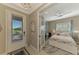 Guest bedroom with a queen-size bed and built-in desk at 26790 Weiskopf Dr, Englewood, FL 34223