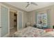 Guest bedroom with a desk and built in shelving at 26790 Weiskopf Dr, Englewood, FL 34223