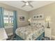 Cozy bedroom with a full-size bed and coastal-themed decor at 26790 Weiskopf Dr, Englewood, FL 34223