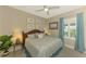 Comfortable guest bedroom with coastal decor and a queen-size bed at 26790 Weiskopf Dr, Englewood, FL 34223