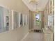 Bright entryway with hardwood floors, art, and a stylish console table at 26790 Weiskopf Dr, Englewood, FL 34223