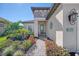 Front entrance of the house with a walkway and landscaping at 26790 Weiskopf Dr, Englewood, FL 34223