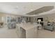 Open concept kitchen with island and breakfast bar, stainless steel appliances at 26790 Weiskopf Dr, Englewood, FL 34223