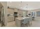 Open concept kitchen with island, stainless steel appliances, and breakfast bar at 26790 Weiskopf Dr, Englewood, FL 34223
