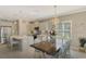 Kitchen with island, stainless steel appliances, and dining area at 26790 Weiskopf Dr, Englewood, FL 34223