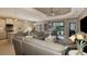 Open floor plan combining kitchen and living area with pool access at 26790 Weiskopf Dr, Englewood, FL 34223