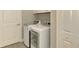 Convenient laundry room with side-by-side washer and dryer at 26790 Weiskopf Dr, Englewood, FL 34223