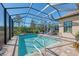 Screened pool and patio with plenty of seating at 26790 Weiskopf Dr, Englewood, FL 34223
