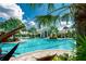Inviting resort-style pool surrounded by lush landscaping at 26790 Weiskopf Dr, Englewood, FL 34223