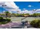 Well-maintained tennis courts with ample seating at 26790 Weiskopf Dr, Englewood, FL 34223