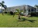 Expansive backyard with screened enclosure and pool at 3090 Lockwood St, Port Charlotte, FL 33952