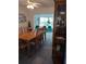 Bright dining room with wood table and view to living room at 3090 Lockwood St, Port Charlotte, FL 33952