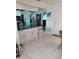 Kitchen features a breakfast bar with seating and stainless steel appliances at 3090 Lockwood St, Port Charlotte, FL 33952