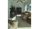 Relaxing living room featuring comfy sofas and a fireplace at 3090 Lockwood St, Port Charlotte, FL 33952