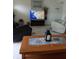 Spacious living room with comfortable seating and a large TV at 3090 Lockwood St, Port Charlotte, FL 33952