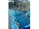 Refreshing screened pool area with ample lounge space at 3090 Lockwood St, Port Charlotte, FL 33952