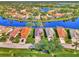 Aerial view of several homes on a waterfront street at 3179 Osprey Ln, Port Charlotte, FL 33953
